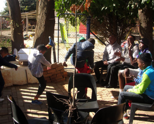 Children showing CSIR ICC staff their dancing skills.